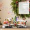 Glitzhome® 20" Lighted Christmas Santa Train Resin Village with Movement and Music